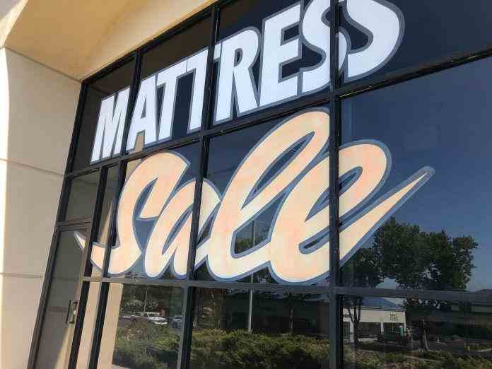 Hand-painted window signage designed to promote specials and sale items, helping business owners attract attention from a distance or passerbys