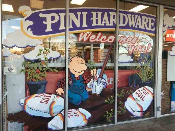 Custom hand-painted window signage for storefronts, designed to welcome customers and showcase products