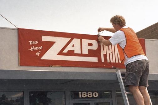 Installing custom vinyl banner on Bay Area commercial building