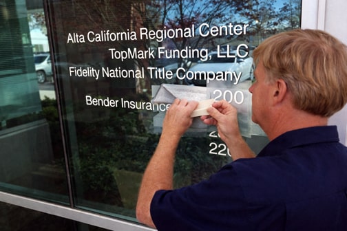 Applying cut vinyl window lettering to glass