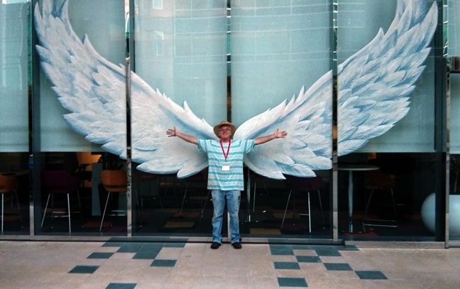 Artist discussing window graphics with business owner